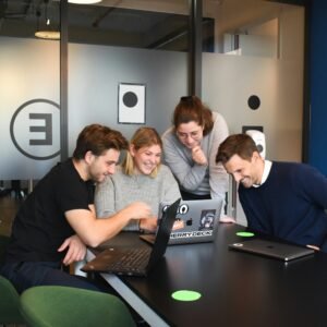 People sitting on chair in front of laptop computers