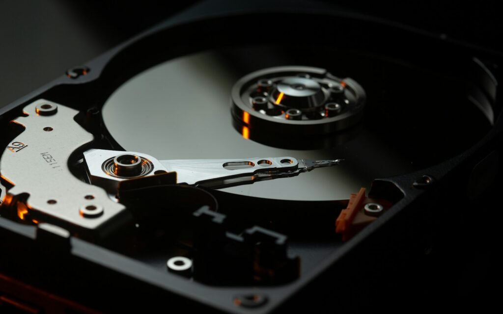 Black and silver turntable on brown wooden table