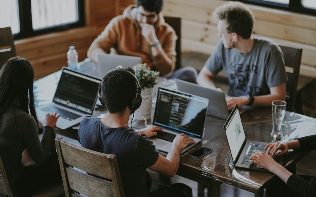 Group of people using laptop computer