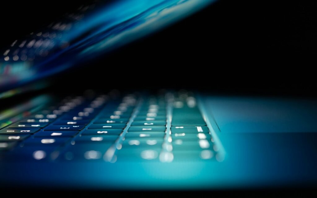 Closeup photo of turned-on blue and white laptop computer
