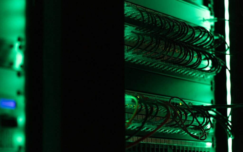 A rack of electronic equipment in a dark room