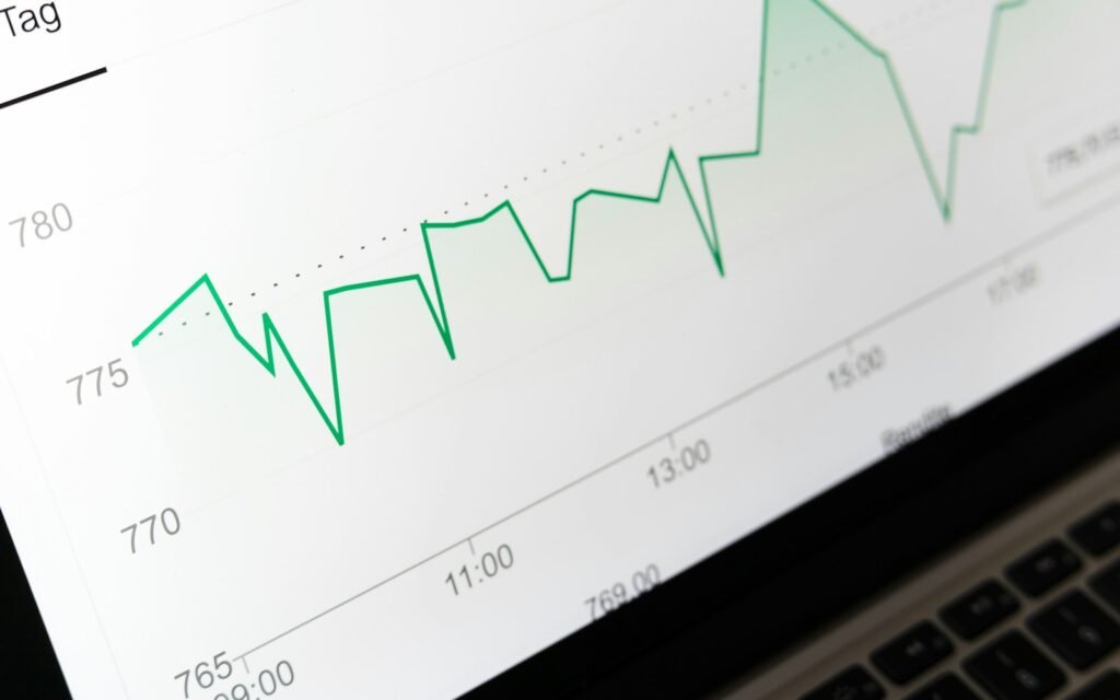 Stock market chart displayed on laptop screen