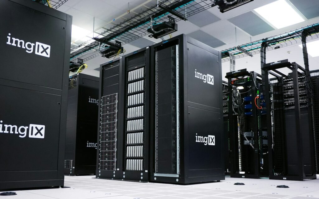 Rows of black server racks with white logos in a data center